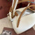 Loro Piana Women's Bale Bucket Bag / Whisper White/Wheat Bran