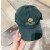 Loro Piana Baseball Cap with Elasticated back Microfibre Storm System in dark green and yellow