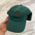 Loro Piana Baseball Cap with Elasticated back Cashmere Storm System in dark green and dark brown